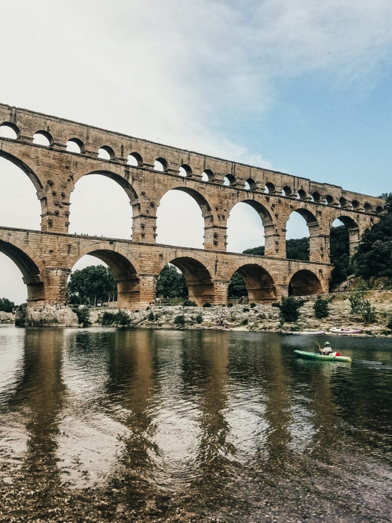 Kayaking under Pont du Gard Roman Aqueduct during Uniworld River Cruise excursion